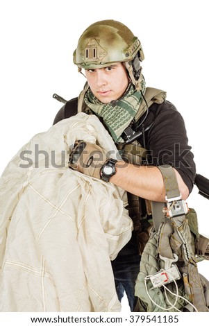Portrait soldier or private military contractor with a parachute. war, army and people concept. image isolated on a white background.