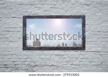 Wooden board with sunny sky cityscape view on old bricks wall.