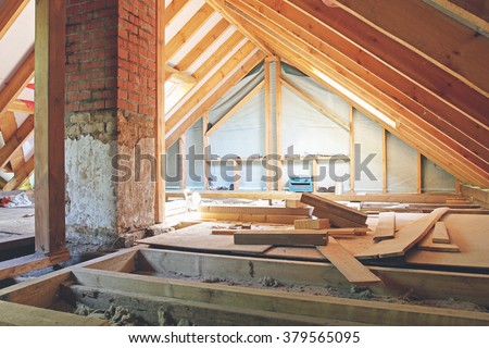 an interior view of a house attic under construction Royalty-Free Stock Photo #379565095