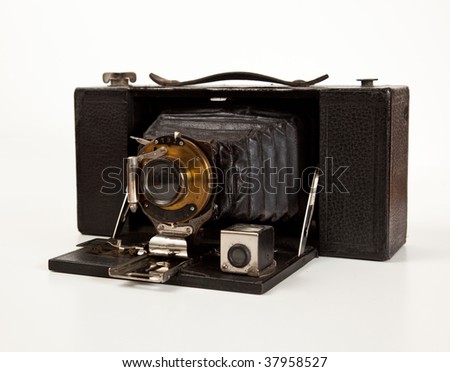 Antique bellows camera in side view isolated on white