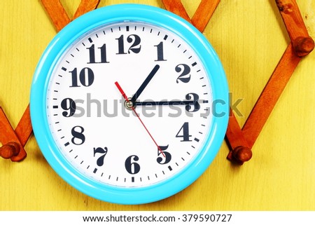 One o'clock on the blue wall clocks