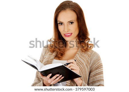 Woman with a notebook.
