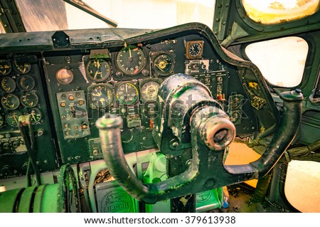 Plane cockpit, old aircraft interior in retro style. Retro aviation, aircraft instruments, cockpit detail.