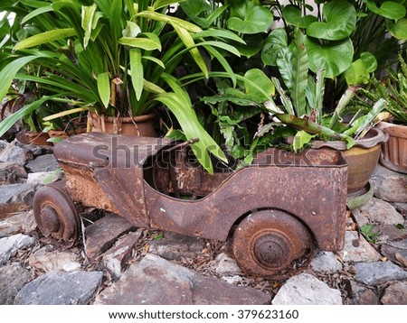 Antique children toy car in garden