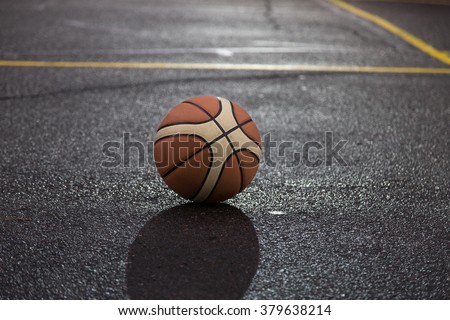 Ball for basketball on the court. Closeup with selective focus. Photo can be used as a whole background.