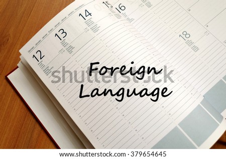 Foreign language text concept write on notebook with pen
