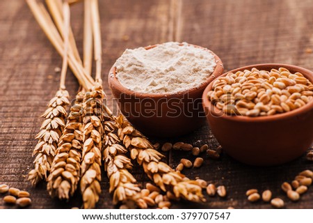 Photo  of  fresh wheat grains and flour 