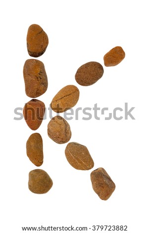 collection of letters of ocean stones close-up isolated on white background.