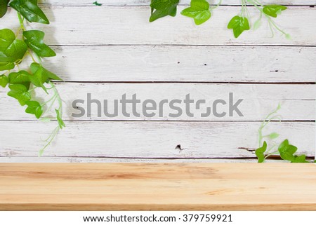 Wood table top on wood and flower background- can be used for display or montage your products