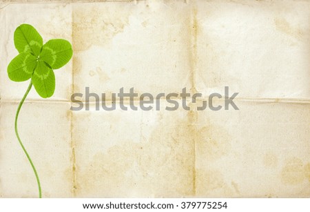 clover symbol on old background with empty paper