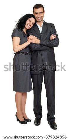 Couple embrace, studio portrait on white. Dressed in black suit.