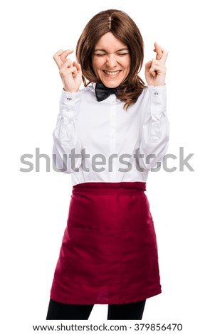 Waitress with her fingers crossing