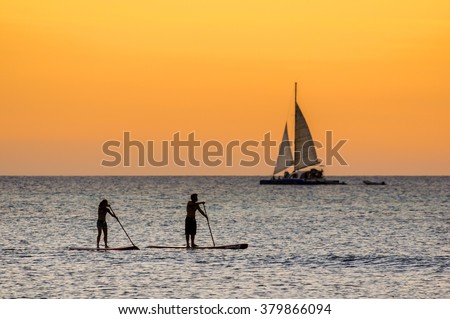 The afternoon is about to end while doing some paddle surf at 
Hadicurari Beach, Aruba, Netherland Antilles.
 Royalty-Free Stock Photo #379866094