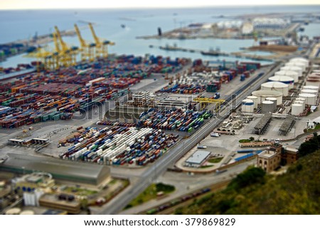 Barcelona harbor with cargo and factories. Tilt Shift Effect