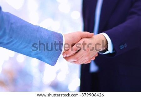 Businessmen shaking hands, isolated on white. 