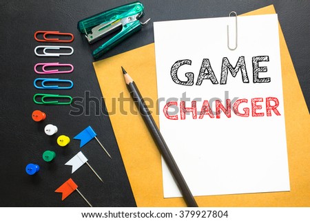 Text Game changer on white paper background / business concept