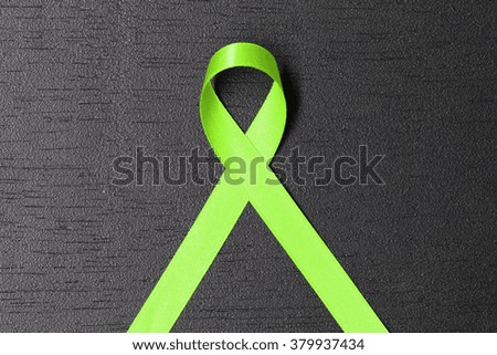 Lime green ribbon. Lymphoma Awareness. Mental health awareness. Healthcare and medicine concept.