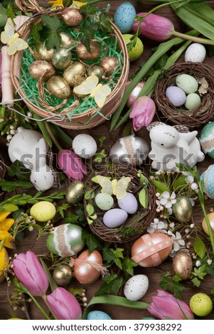Close up of Easter assortiment of Easter eggs, spring flowers, and toys.
