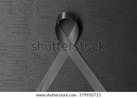 Black ribbon. melanoma awareness. Mourning symbol.