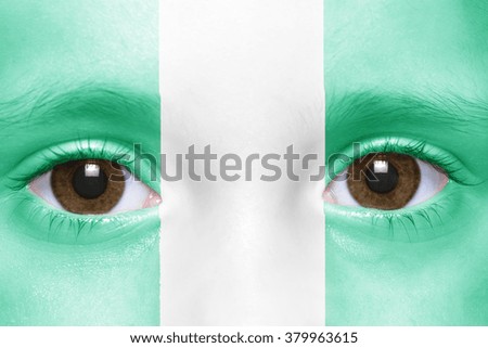 human's face with nigerian flag 