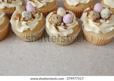 Homemade Easter eggs cupcakes,copy space background