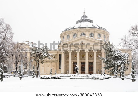 Bucharest, Romania - January 17: University Square on January 17, 2016 in Bucharest, Romania. The Romanian Athenaeum George Enescu Ateneul Roman opened in 1888 is a concert hall in the center Royalty-Free Stock Photo #380043328