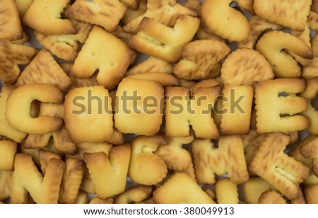 cookie alphabet on cookie background.