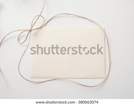 sheet of paper with bow and place for text. Greating card