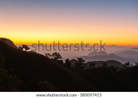 Sunset over black mountains in the fog, Mountain layer background at Doi Tu Lay (Mon Tu Lay) , Tak province Thailand (HRD Picture)