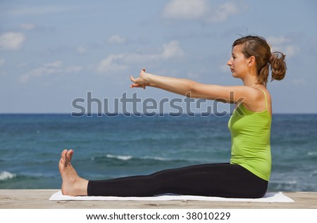fitness and yoga workout on the beach