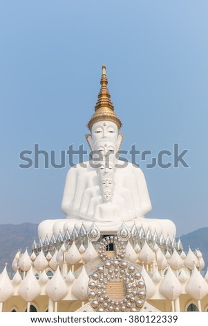 5 white buddha on the mountain with blue sky