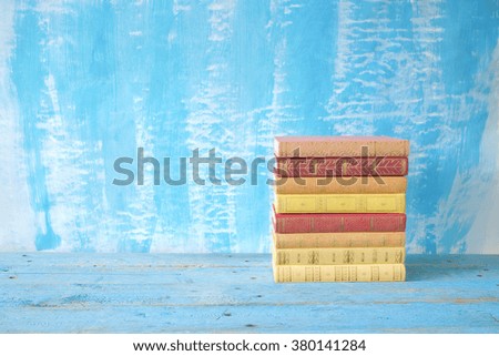 stack of books, grungy background, free copy space 