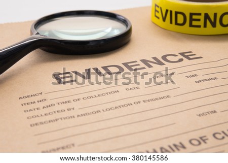 magnifying glass and evidence bag for detective and crime scene investigation Royalty-Free Stock Photo #380145586