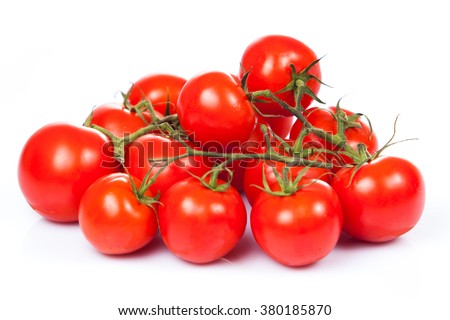 fresh tomatoes with green leaves isolated on white background Royalty-Free Stock Photo #380185870