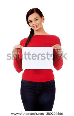 Smile young woman holding blank white banner