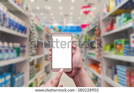 Pharmacy and drugstore, The women using smart phone in pharmacy on blurred background Royalty-Free Stock Photo #380228902