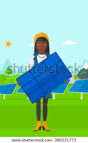 Woman holding solar panel.
