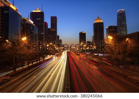Skyline and traffic in Beijing's Central Business District at dusk. Beijing, China