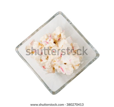 Corn salad with eggs and crab sticks. Isolated on a white background.
