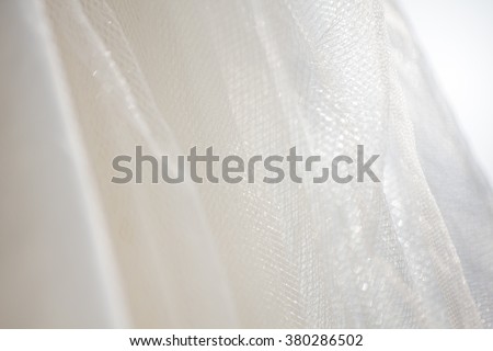 Striped silk bridal gown wedding dress concept used as a background for illustrations and text.