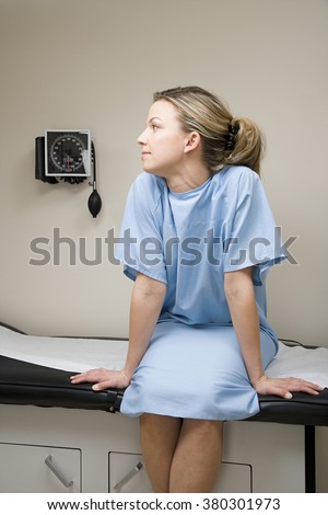 Woman waiting on treatment couch