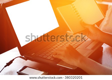 office desk with laptop smart phone.Hand write notes