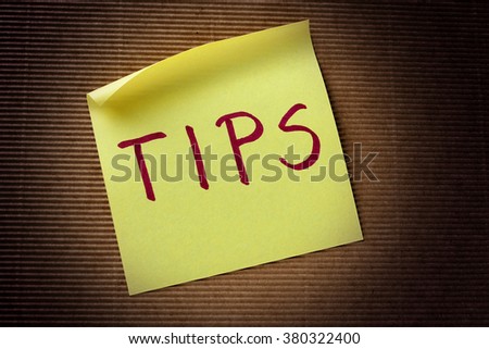 tips text on yellow sticky note