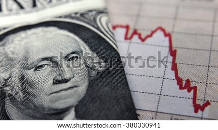 Stock Market Graph next to a 1 dollar bill (showing former president Washington). Red trend line indicates the stock market recession period Royalty-Free Stock Photo #380330941