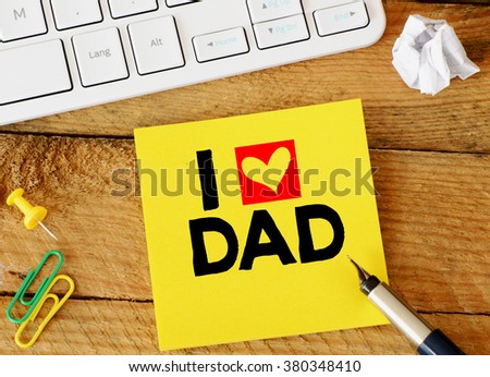 i love dad  inscription. Paper sticker with i love dad  inscription over computer keyboard