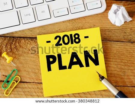2018 plan inscription. paper sticker with 2018 plan inscription over computer keyboard.