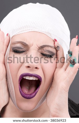picture of screaming wounded woman face over grey