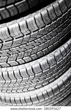 Car tires in a stack at an automotive repair service shop