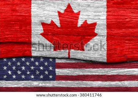 canada and USA flag on old wood texture pattern background
