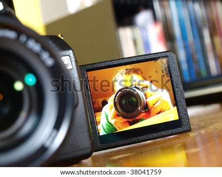 DSLR camera with photographer image